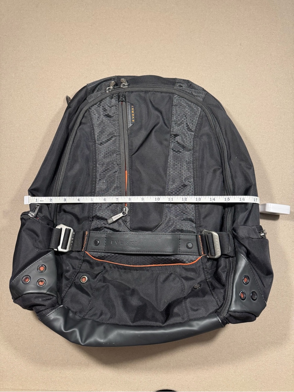 Black Men's Travel Backpack with Orange Accents Everki large laptop bag.